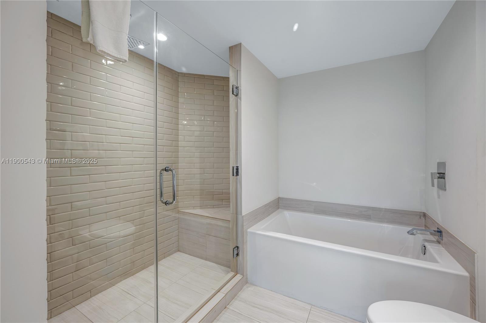 4010 South Ocean Drive, Unit R2501 Hollywood, FL 33019 - Photo 16 of 20 a bathroom with a bathtub and shower
