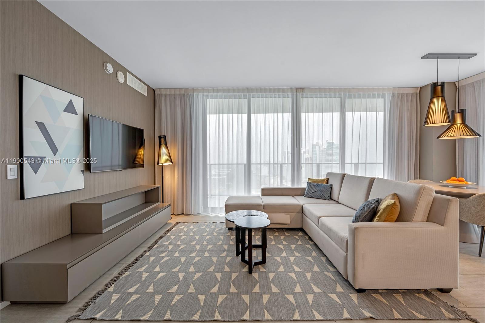 4010 South Ocean Drive, Unit R2501 Hollywood, FL 33019 - Photo 7 of 20 a living room with furniture and a large window