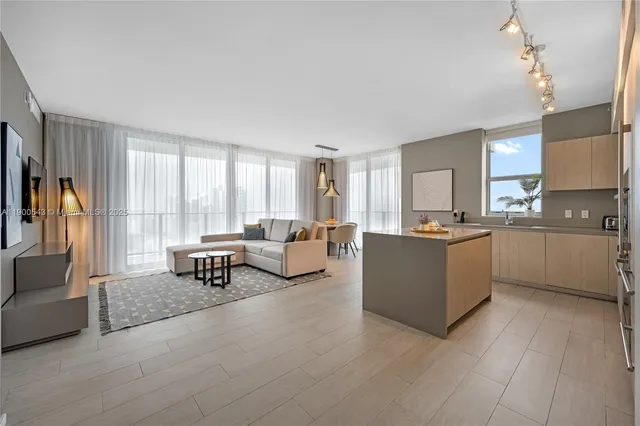 a kitchen with counter and windows