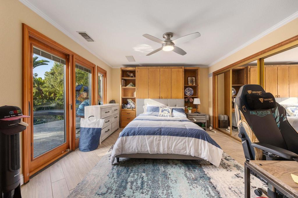 13348 Old Winery Road Poway, CA 92064 - Photo 48 of 68 a bedroom with a bed and wooden floor
