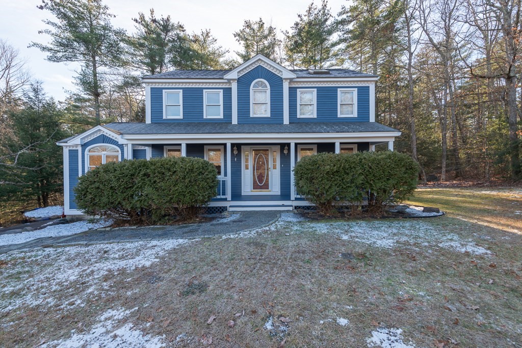 9 Pumpkin Brook Road Shirley, MA 01464 - Photo 1 of 37 a front view of a house with garden