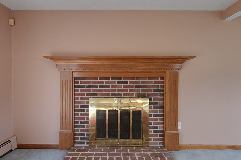 9 Pumpkin Brook Road Shirley, MA 01464 - Photo 14 of 37 a close view of a fireplace