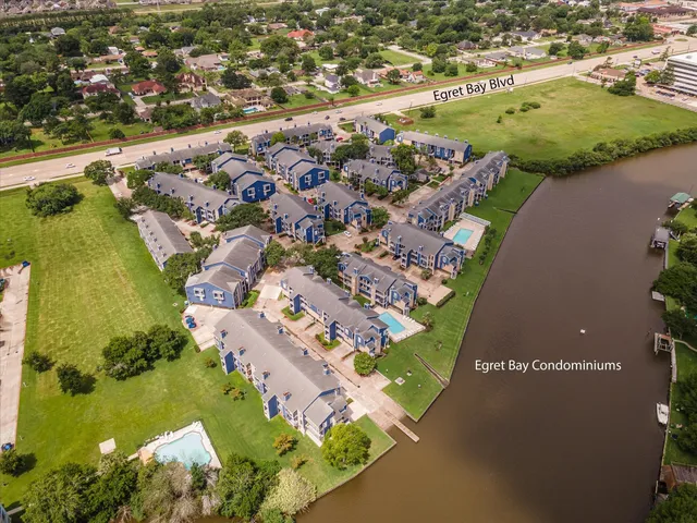 an aerial view of a residential houses with outdoor space