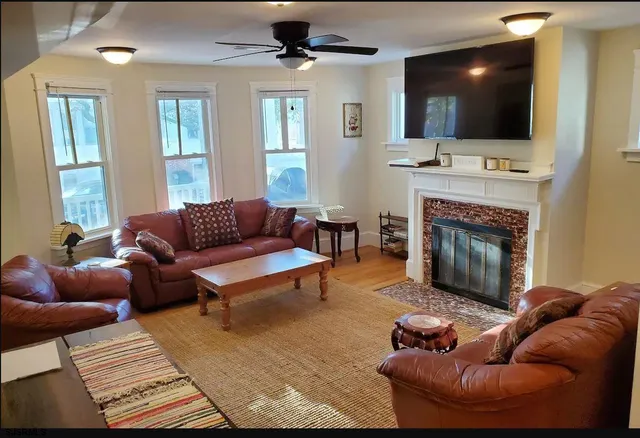 a living room with furniture and a window