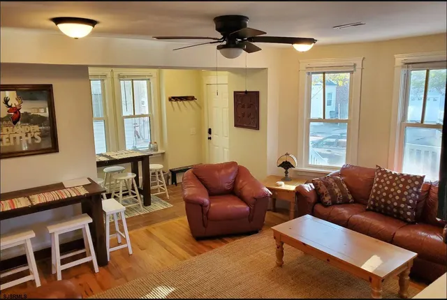 a living room with furniture and a window