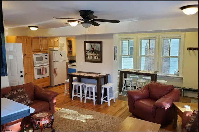 a view of a dining room with furniture and window
