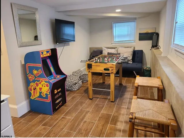 a kitchen with refrigerator cabinets and wooden floor