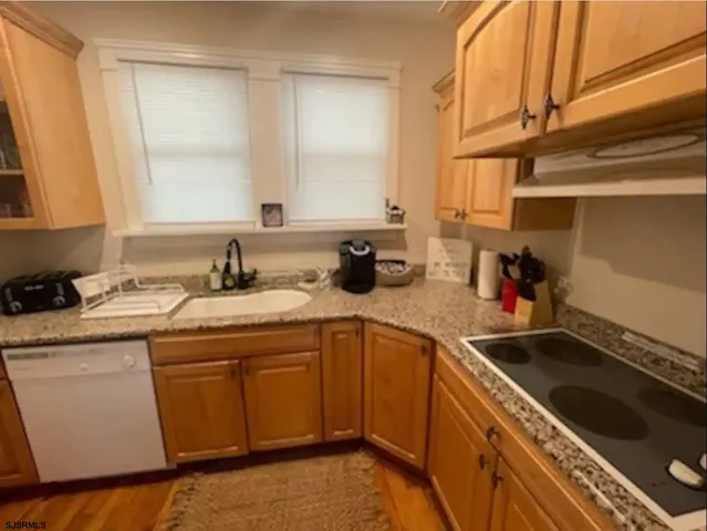 a bedroom with wooden floor