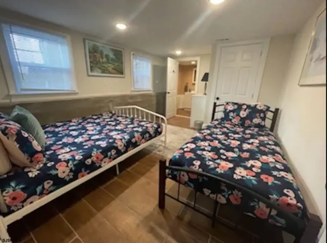 a living room with a rug and a table