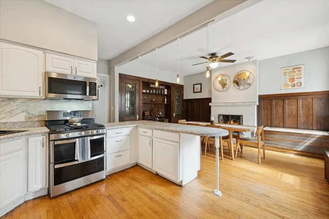 a kitchen with a stove and a microwave oven