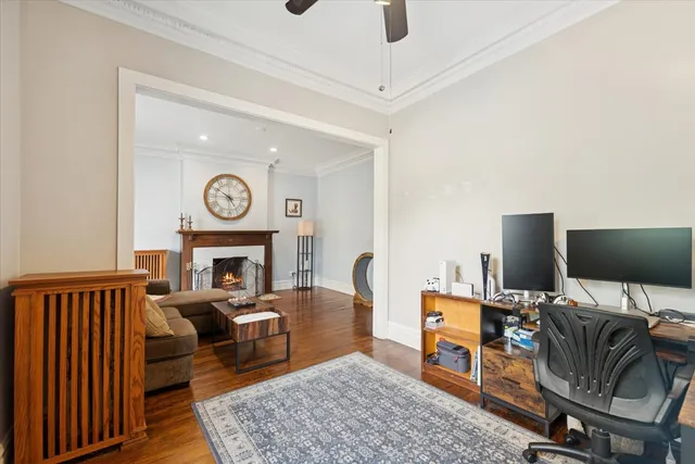 a living room with furniture and a fireplace