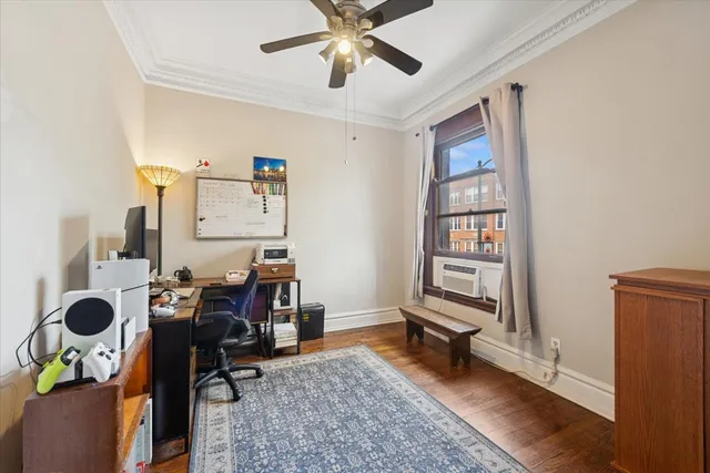 a view of workspace with wooden floor and gym equipment