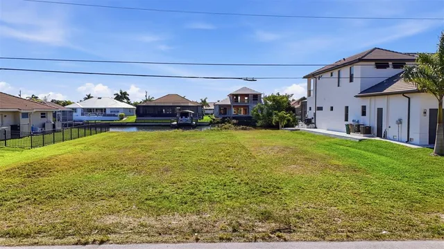 a view of a house with a yard and a patio