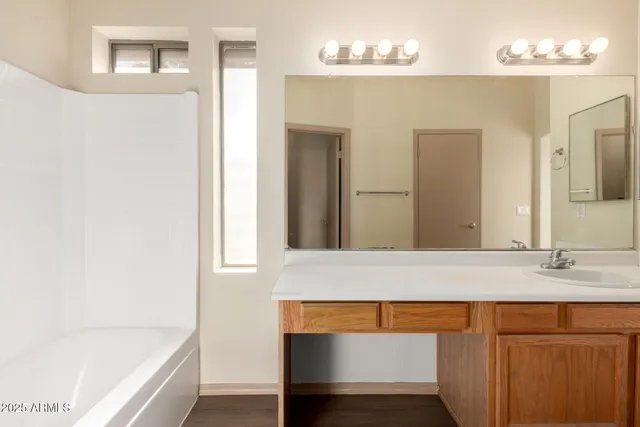a bathroom with a bathtub and a sink