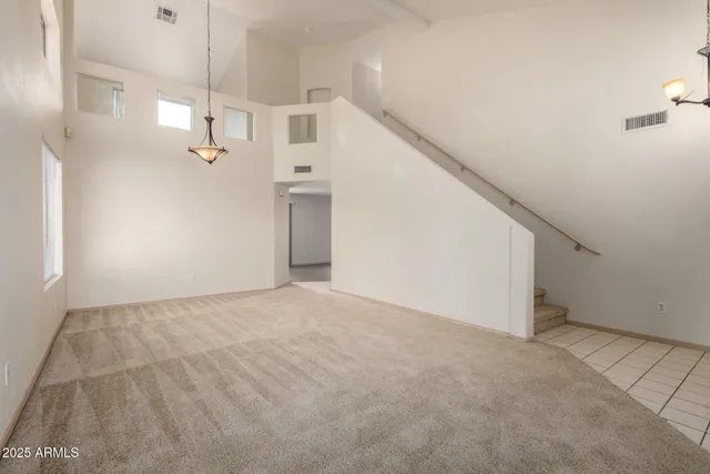 a view of a kitchen with a sink and refrigerator