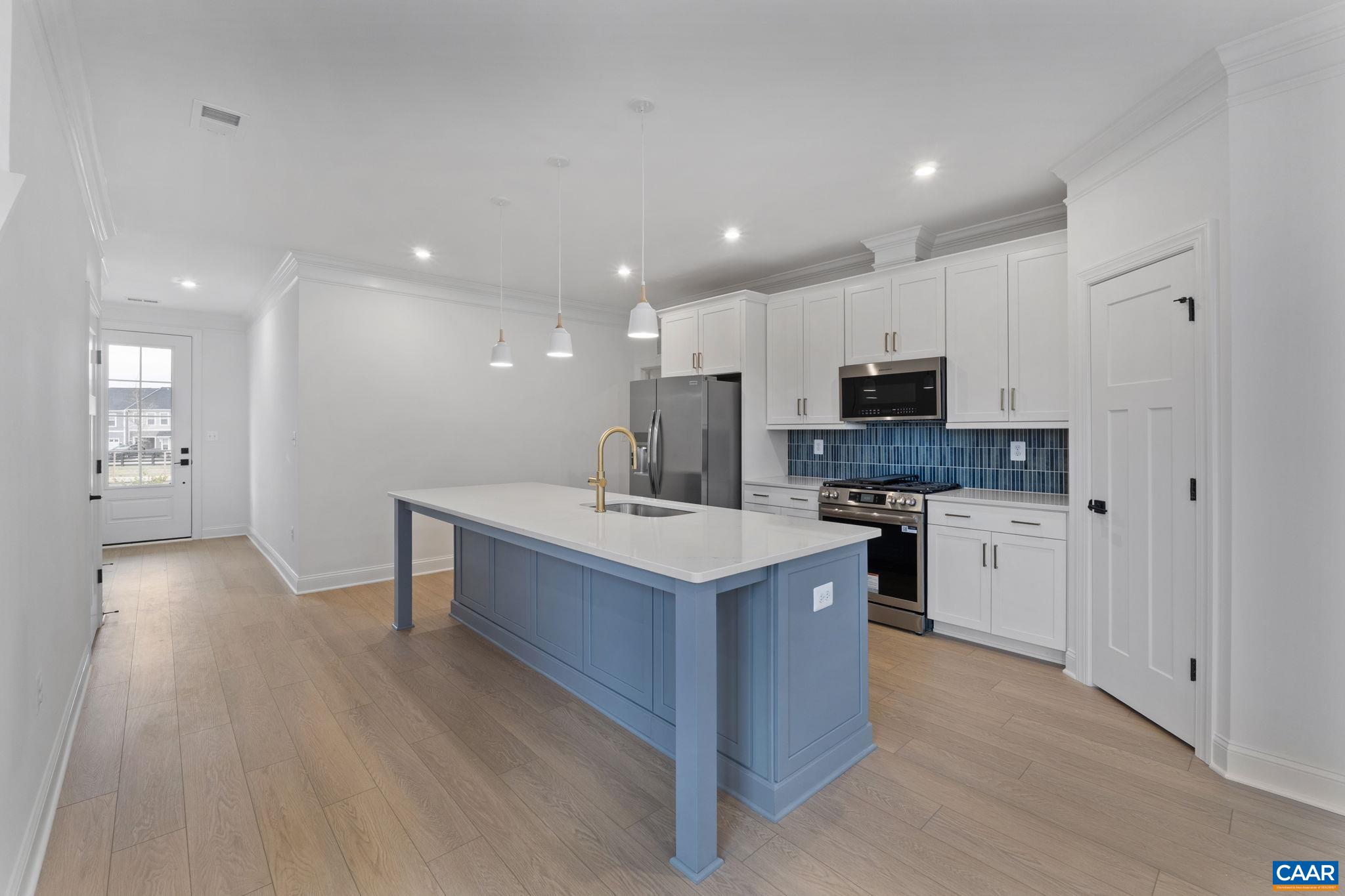 321 Springdale Road Waynesboro, VA 22980 - Photo 16 of 49 a kitchen with stainless steel appliances kitchen island granite countertop a stove and a sink
