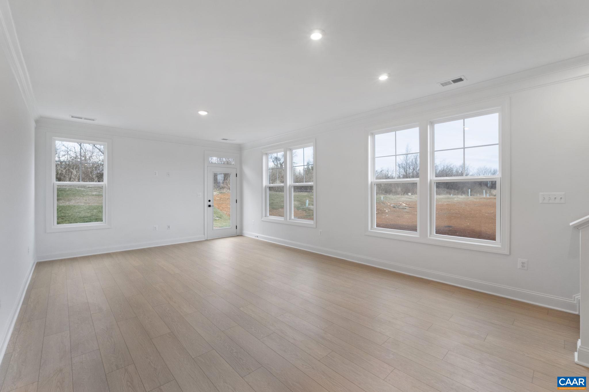 321 Springdale Road Waynesboro, VA 22980 - Photo 17 of 49 an empty room with wooden floor and windows