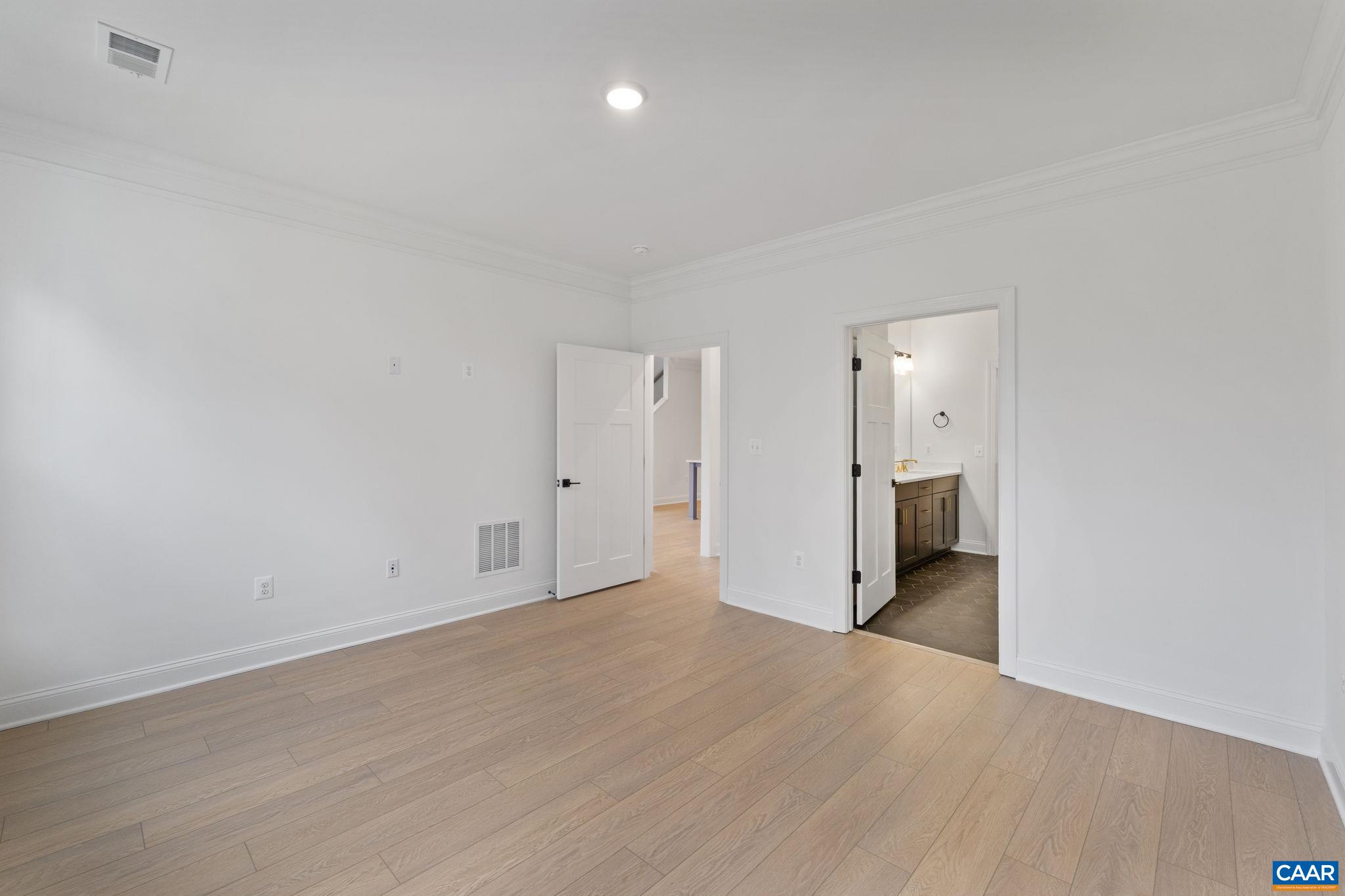 321 Springdale Road Waynesboro, VA 22980 - Photo 22 of 49 a view of an empty room with wooden floor
