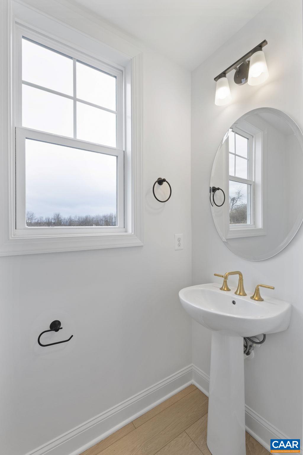 321 Springdale Road Waynesboro, VA 22980 - Photo 7 of 49 a bathroom with a sink a window and a mirror
