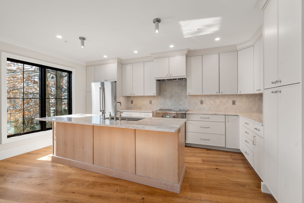 34 Vinton Street, Unit 3 Boston, MA 02127 - Photo 1 of 29 a kitchen with stainless steel appliances granite countertop a sink and cabinets