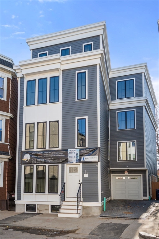 34 Vinton Street, Unit 3 Boston, MA 02127 - Photo 2 of 29 a front view of a building with a parking space