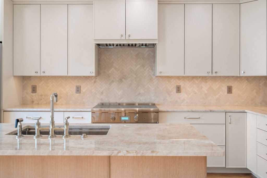 34 Vinton Street, Unit 3 Boston, MA 02127 - Photo 9 of 29 a kitchen with a cabinets and window