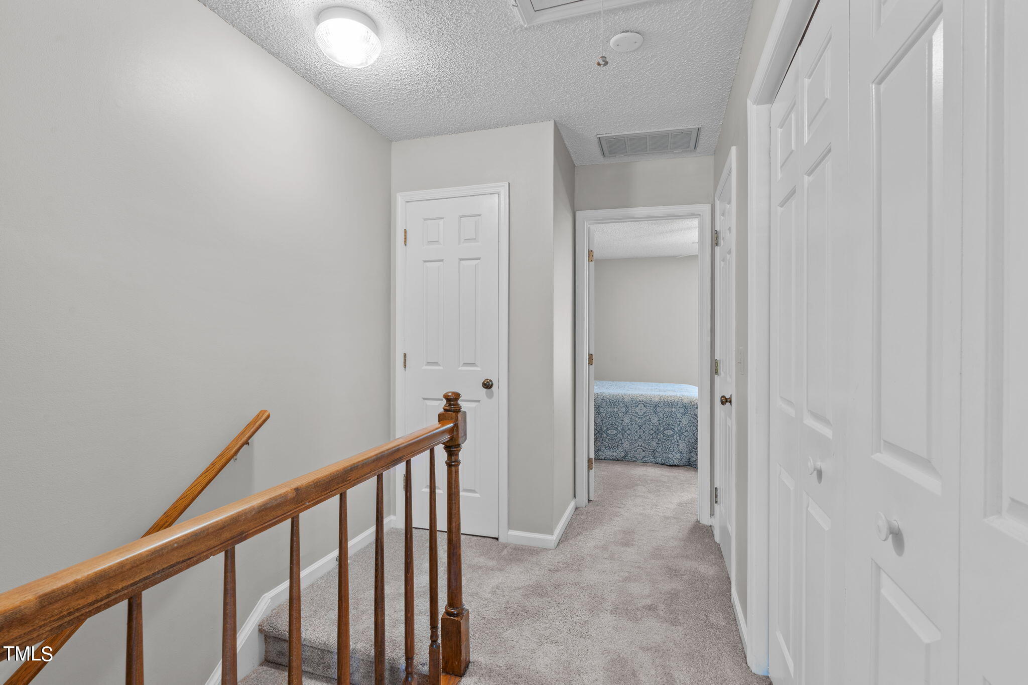6908 Saxby Court Raleigh, NC 27613 - Photo 21 of 27 a view of hallway with an entryway