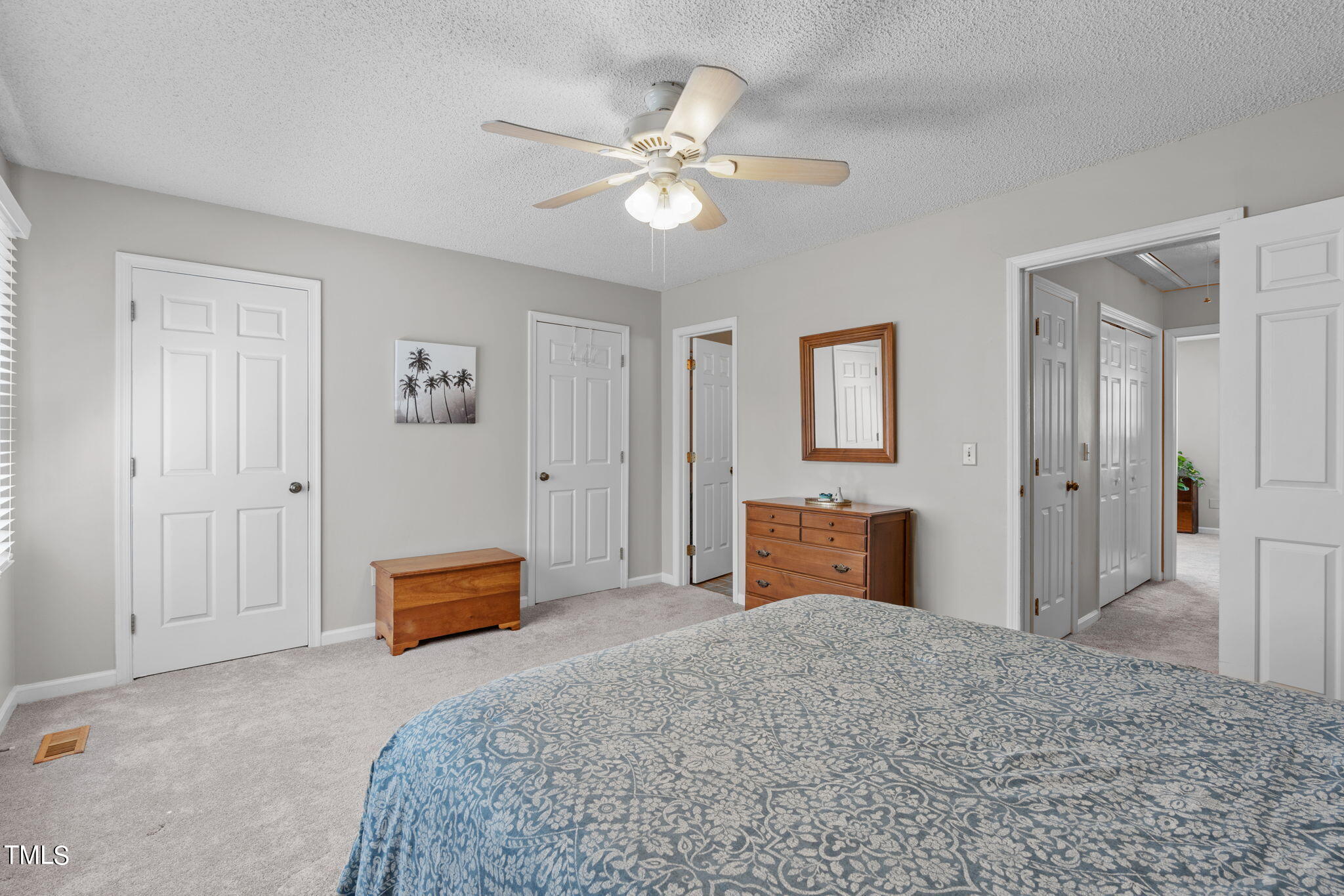 6908 Saxby Court Raleigh, NC 27613 - Photo 24 of 27 a bedroom with a bed and closet
