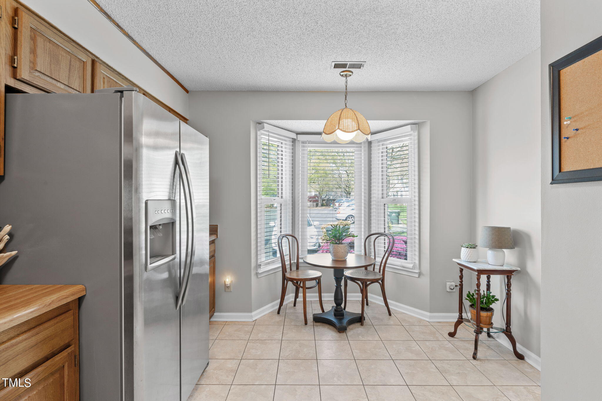 6908 Saxby Court Raleigh, NC 27613 - Photo 9 of 27 a view of a dining room with furniture window and outside view