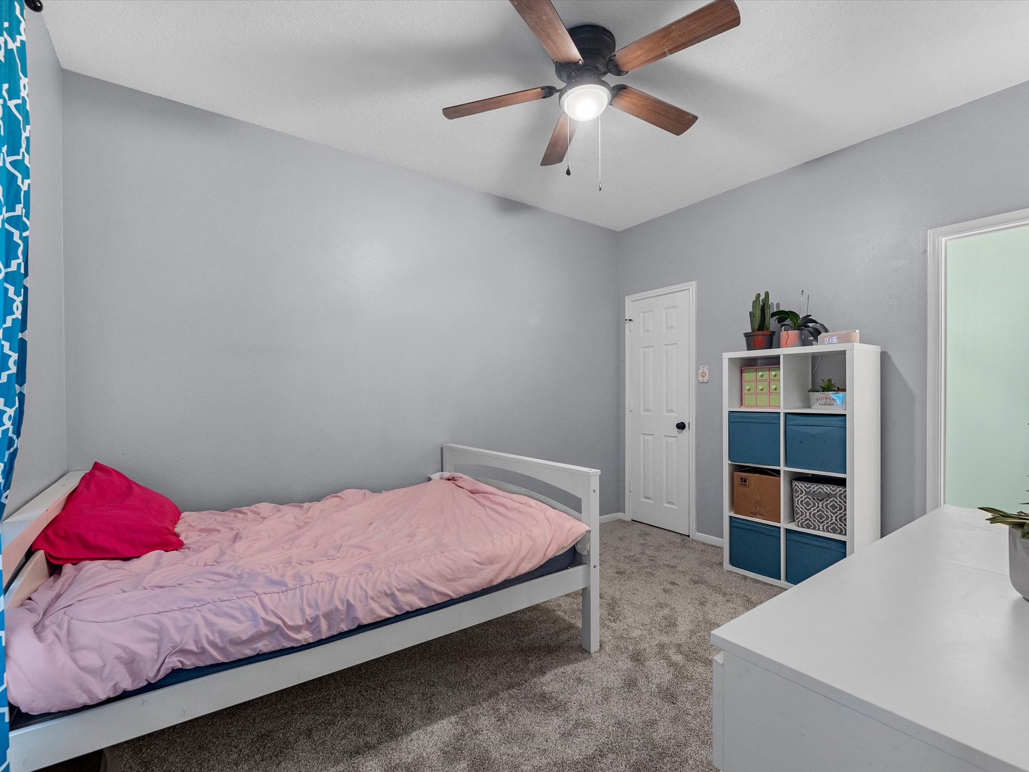 22422 Lamaster Lane Spring, TX 77373 - Photo 15 of 35 Cozy main level bedroom with carpeted flooring. Perfect for a guest room with location being on the main level.