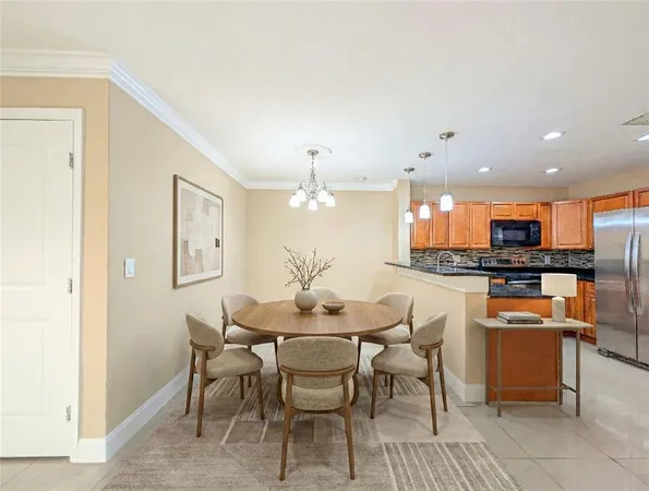 a dining room with a table and chairs