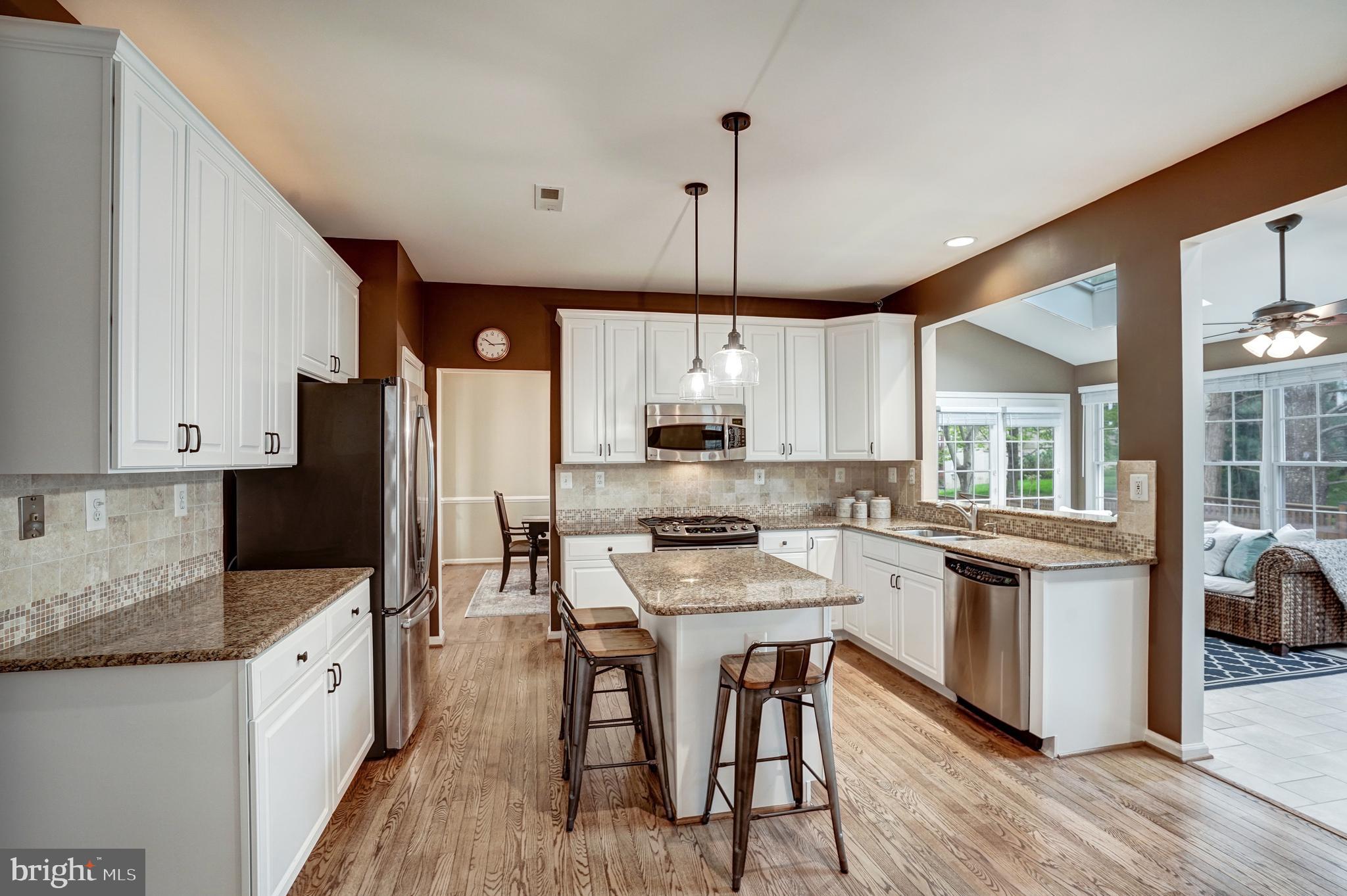 1308 Stable Farm Court Reston, VA 20194 - Photo 13 of 50 Kitchen opens to Sun Room