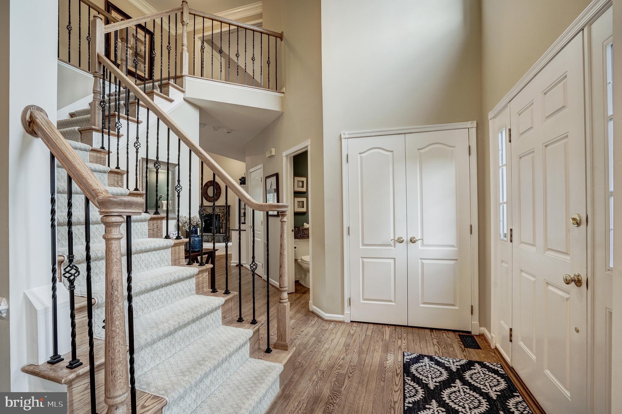 1308 Stable Farm Court Reston, VA 20194 - Photo 5 of 50 Beautiful curved staircase, wrought iron balusters