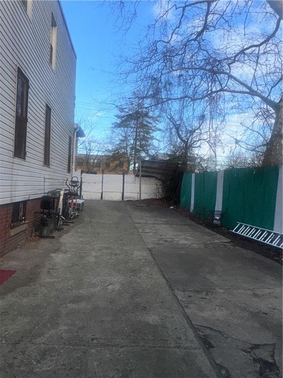 756 Linwood Street Brooklyn, NY 11208 - Photo 6 of 17 a view of a backyard with furniture and a garage