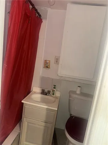 a bathroom with a sink and toilet