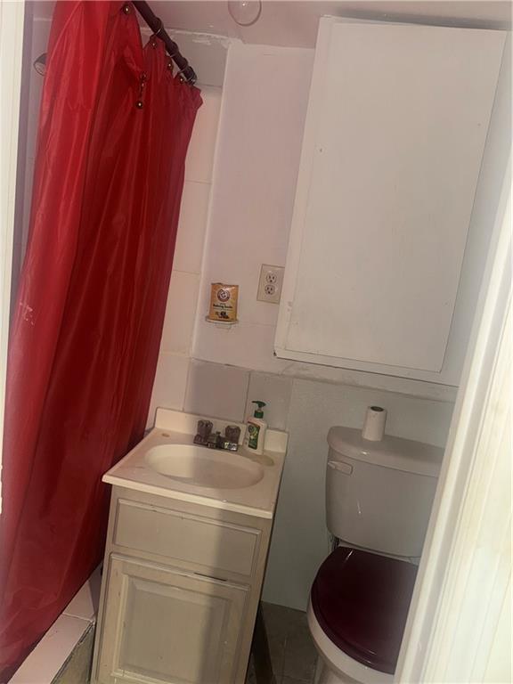 756 Linwood Street Brooklyn, NY 11208 - Photo 9 of 17 a bathroom with a sink and toilet