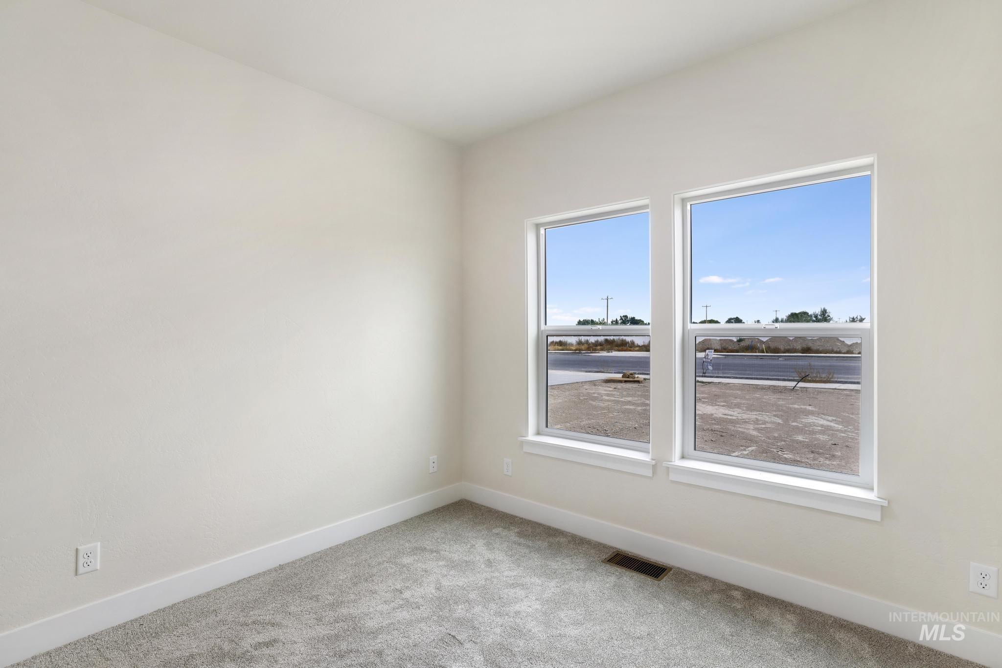 928 Gregory Way Twin Falls, ID 83301 - Photo 17 of 24 Empty room featuring baseboards and carpet