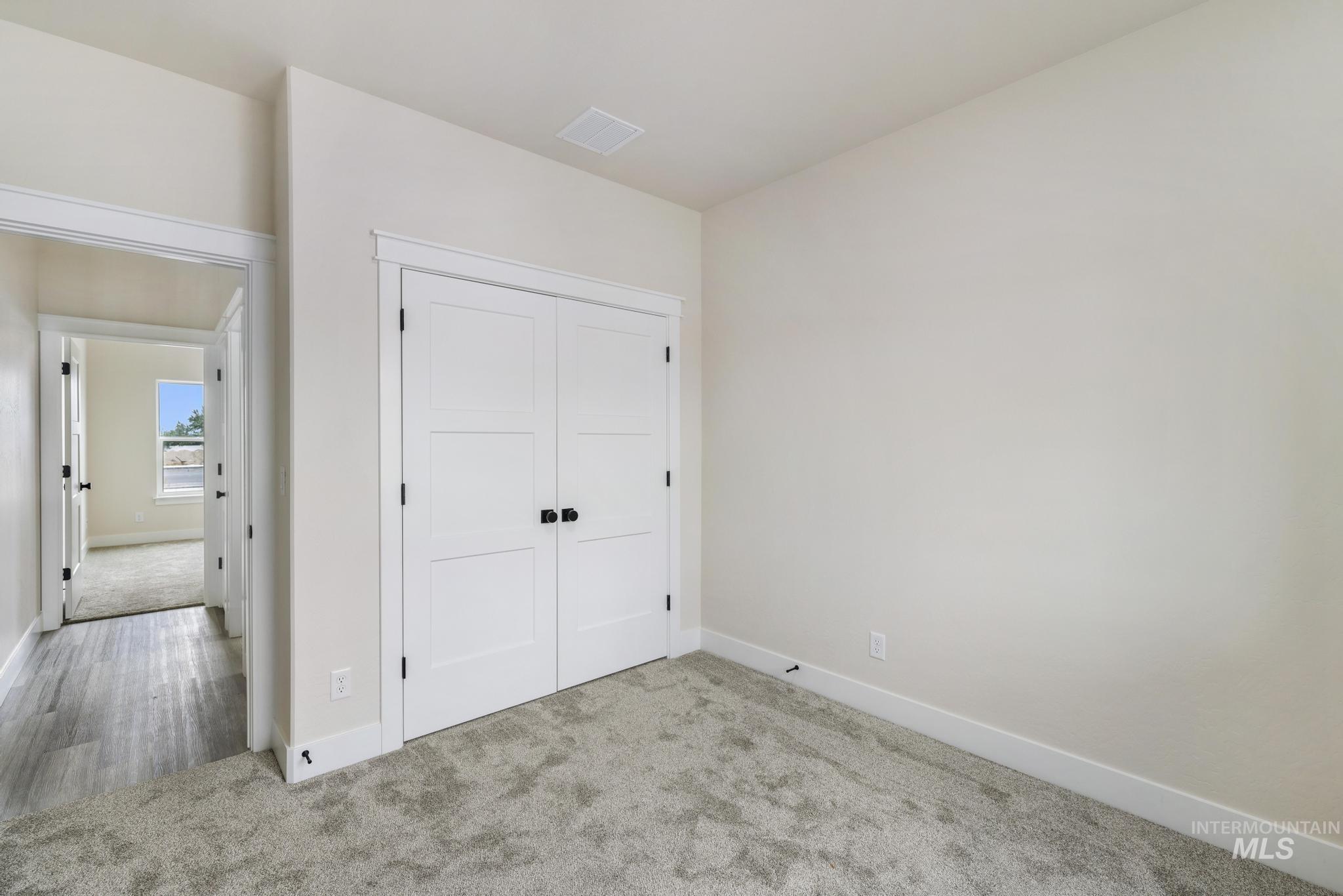 928 Gregory Way Twin Falls, ID 83301 - Photo 18 of 24 Unfurnished bedroom featuring carpet flooring and a closet