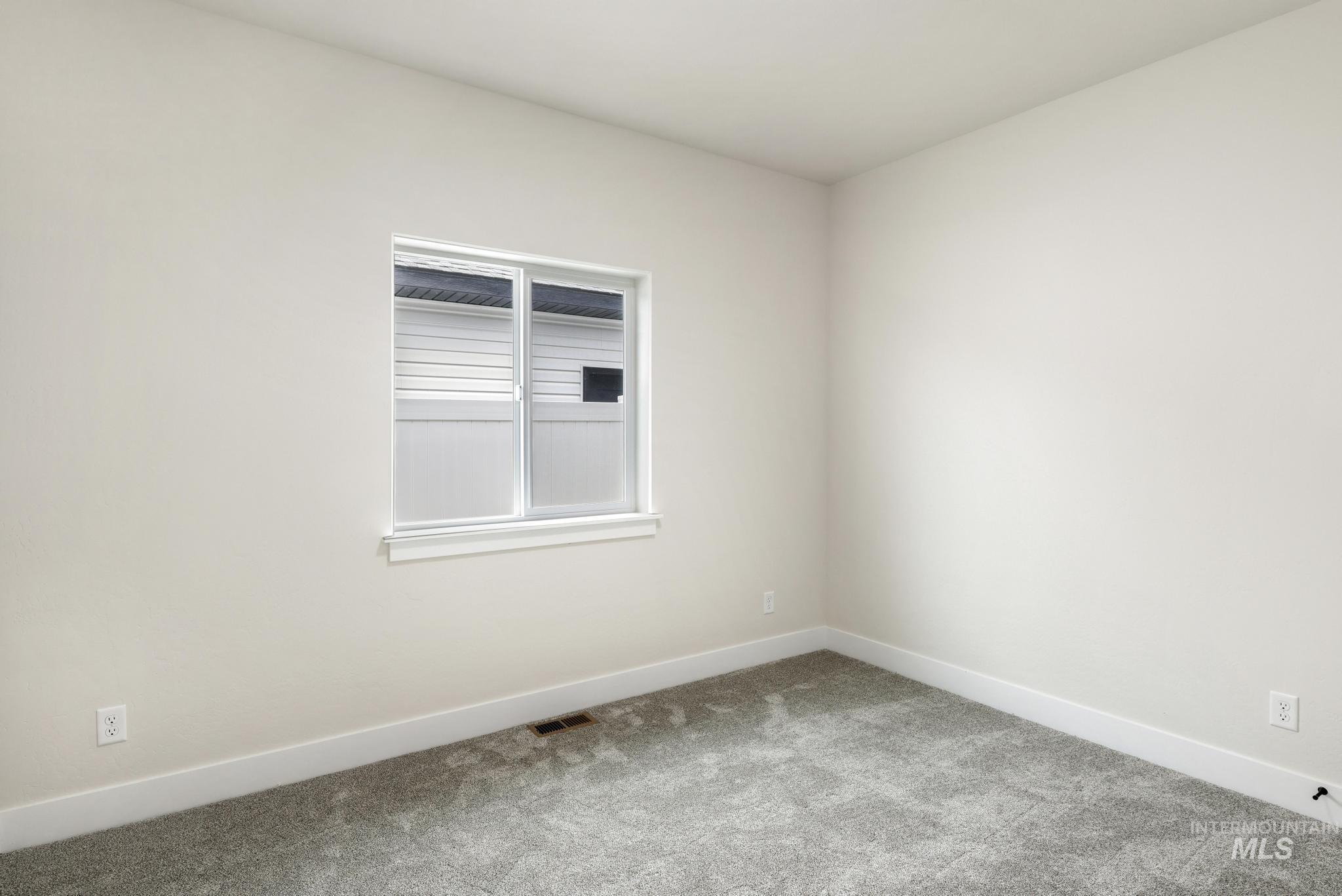 928 Gregory Way Twin Falls, ID 83301 - Photo 20 of 24 Carpeted empty room featuring baseboards