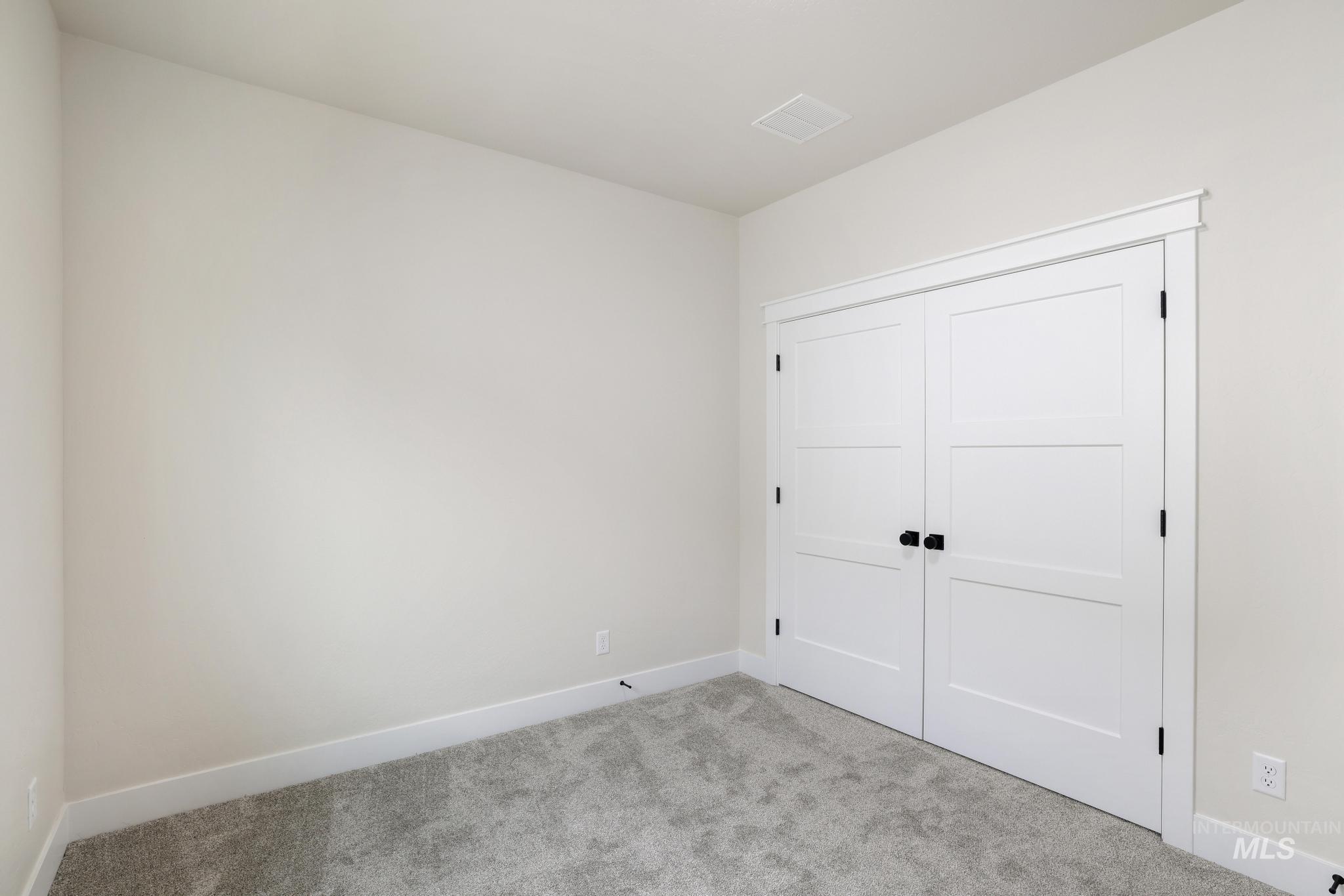 928 Gregory Way Twin Falls, ID 83301 - Photo 21 of 24 Unfurnished bedroom with carpet and a closet