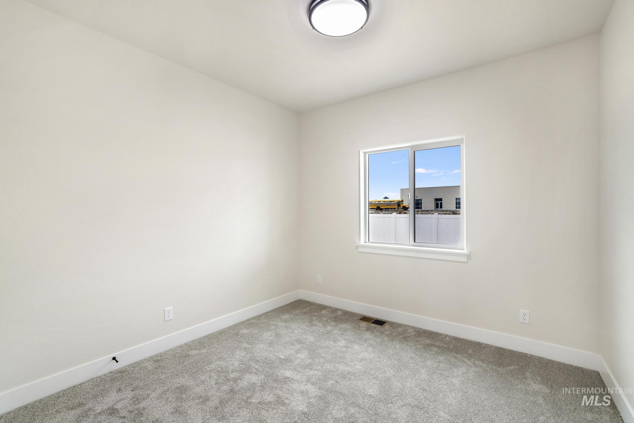 928 Gregory Way Twin Falls, ID 83301 - Photo 22 of 24 Empty room with baseboards and carpet