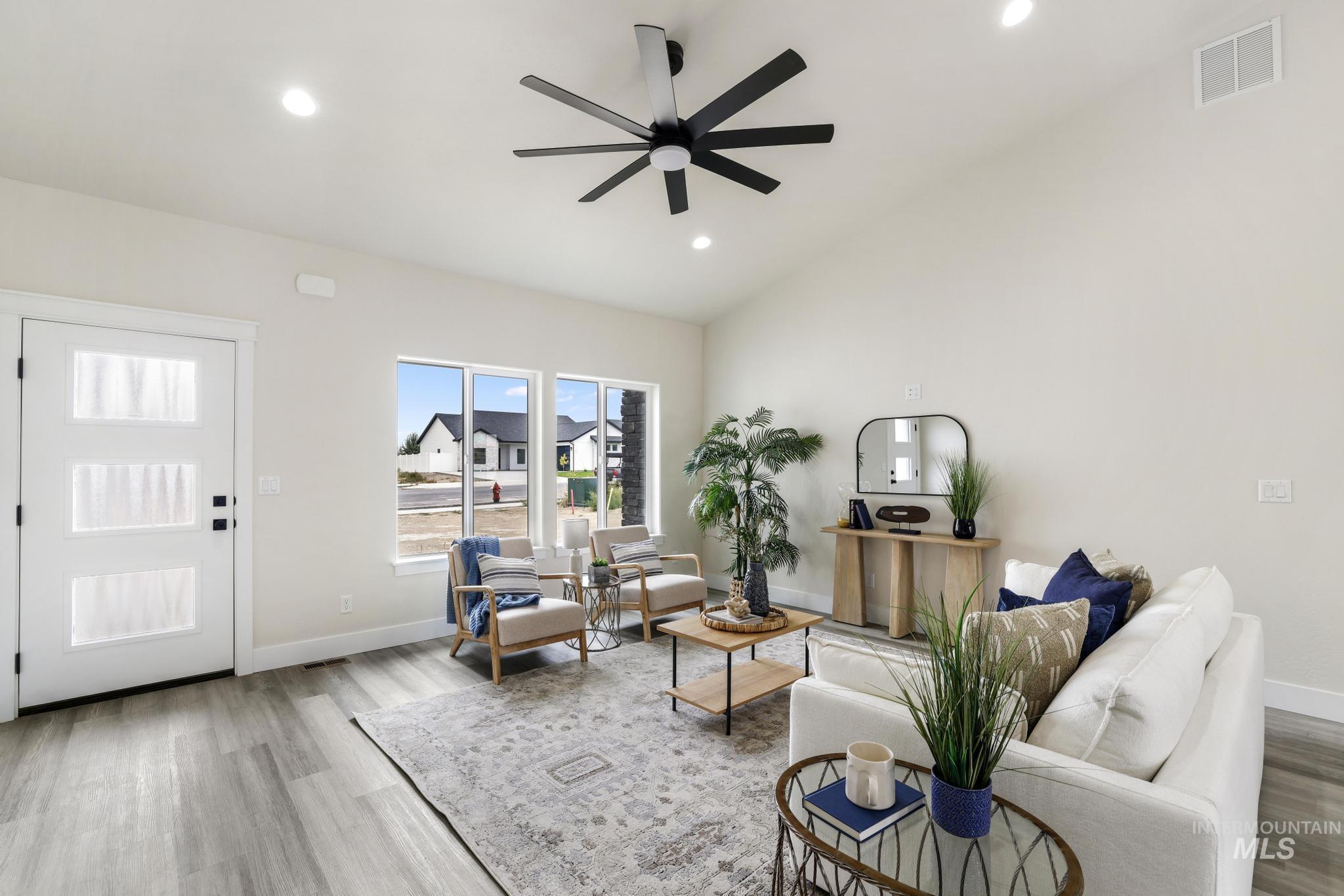 928 Gregory Way Twin Falls, ID 83301 - Photo 5 of 24 Living area featuring light wood-style flooring, lofted ceiling, recessed lighting, and ceiling fan