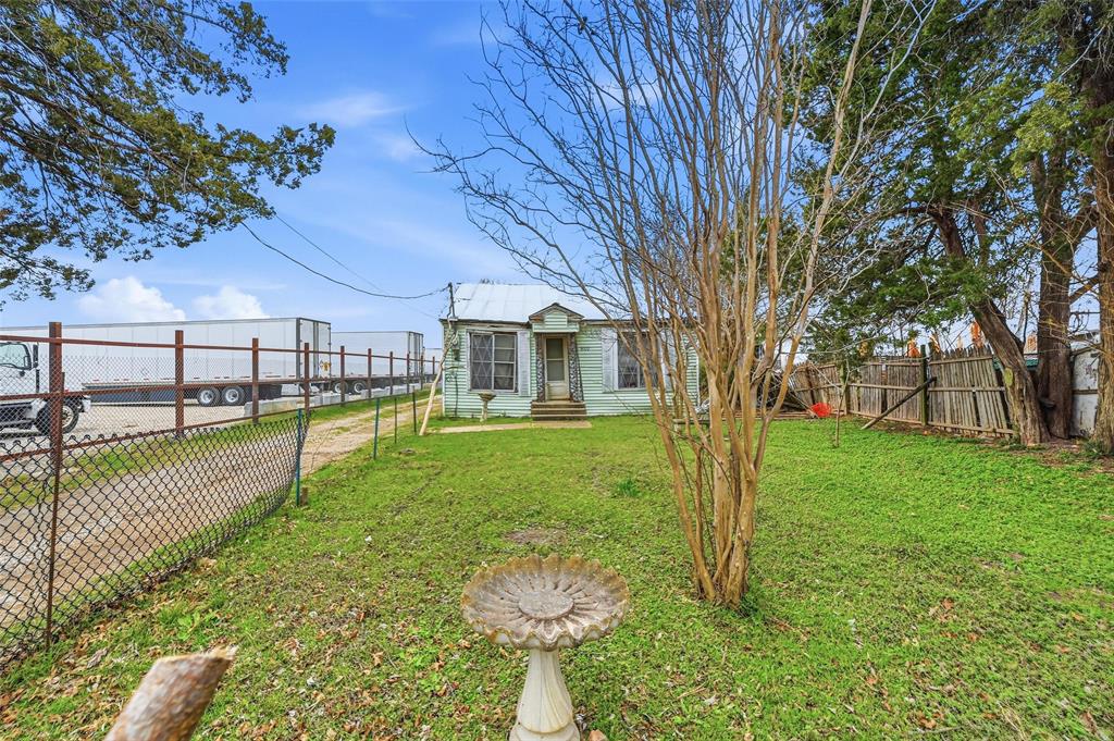 8322 Honeysuckle Lane Dallas, TX 75241 - Photo 14 of 15 a view of a house with a swimming pool