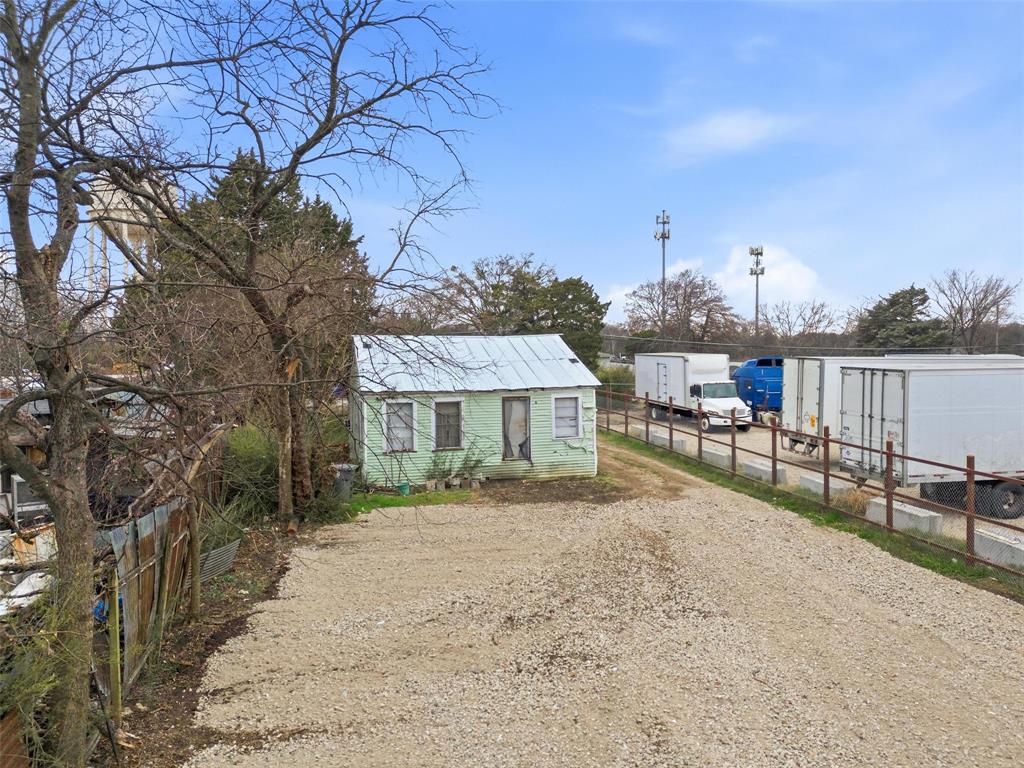 8322 Honeysuckle Lane Dallas, TX 75241 - Photo 8 of 15 a view of a house with a yard