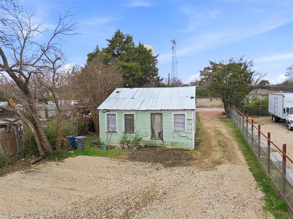 8322 Honeysuckle Lane Dallas, TX 75241 - Photo 10 of 15 a view of a house with a yard