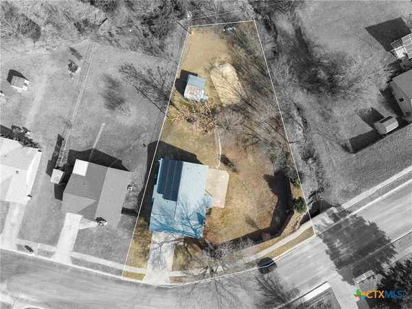 an aerial view of residential house with outdoor space