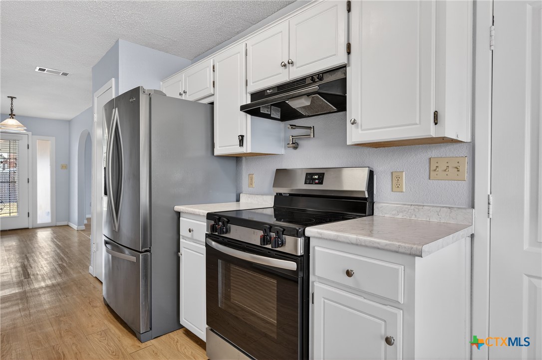 3421 Chisholm Trail Killeen, TX 76542 - Photo 13 of 34 Glass top range installed in 2026—only used once! with a pot filler over the range!