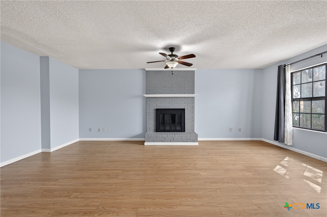 3421 Chisholm Trail Killeen, TX 76542 - Photo 5 of 34 a view of an empty room with a fireplace and a window