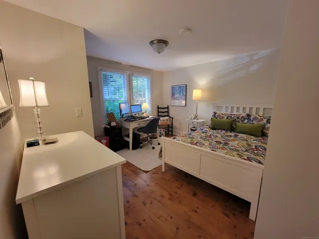 a living room with furniture window and lamp