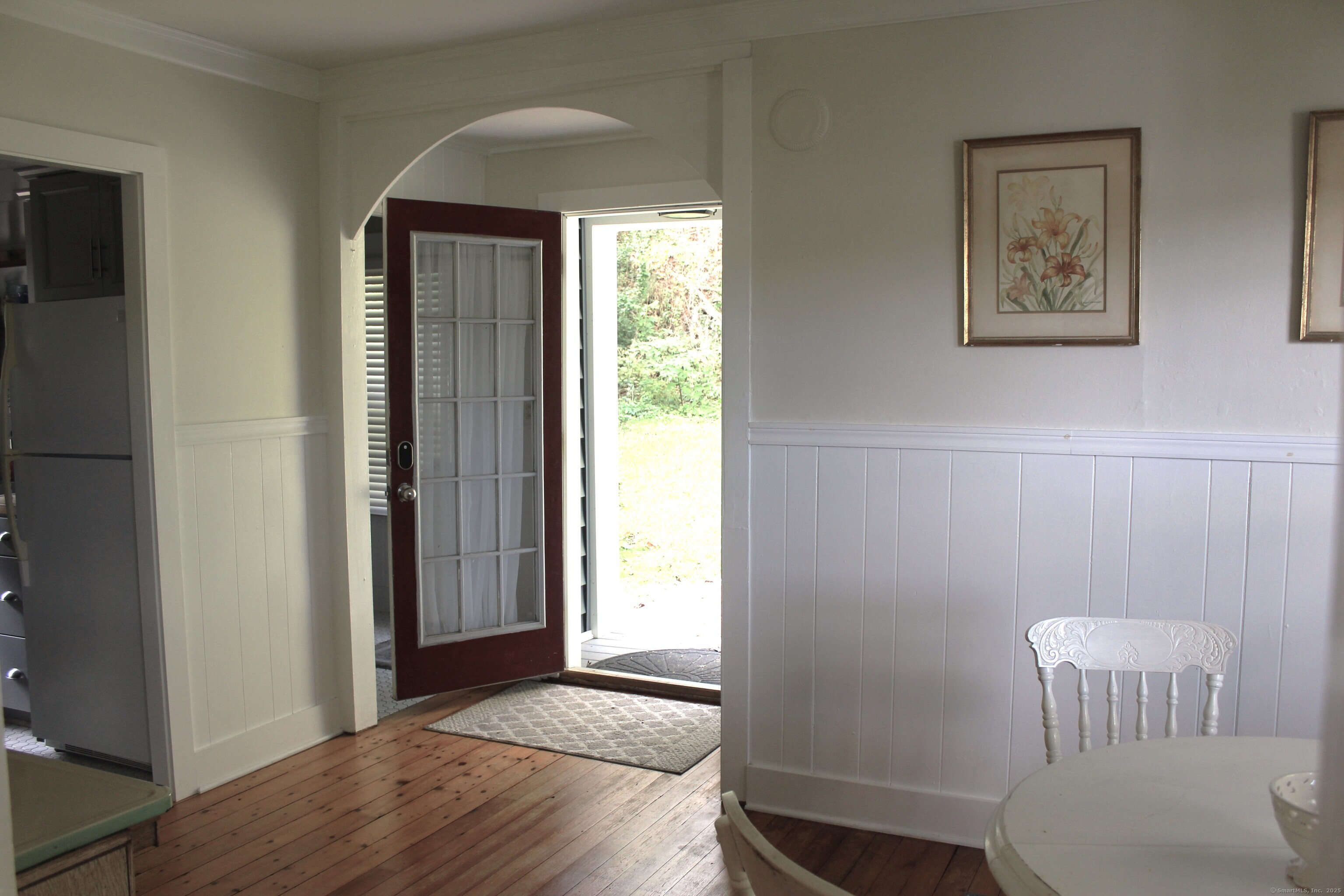 6 West Main Street Chester, CT 06412 - Photo 23 of 37 a view of a hallway with wooden floor and a bathroom